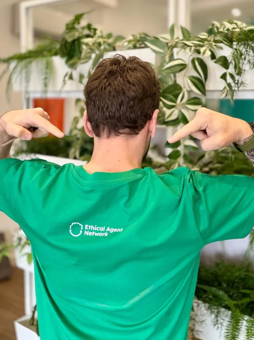 The Ethical Agent Network mark printed on the back of the shirt