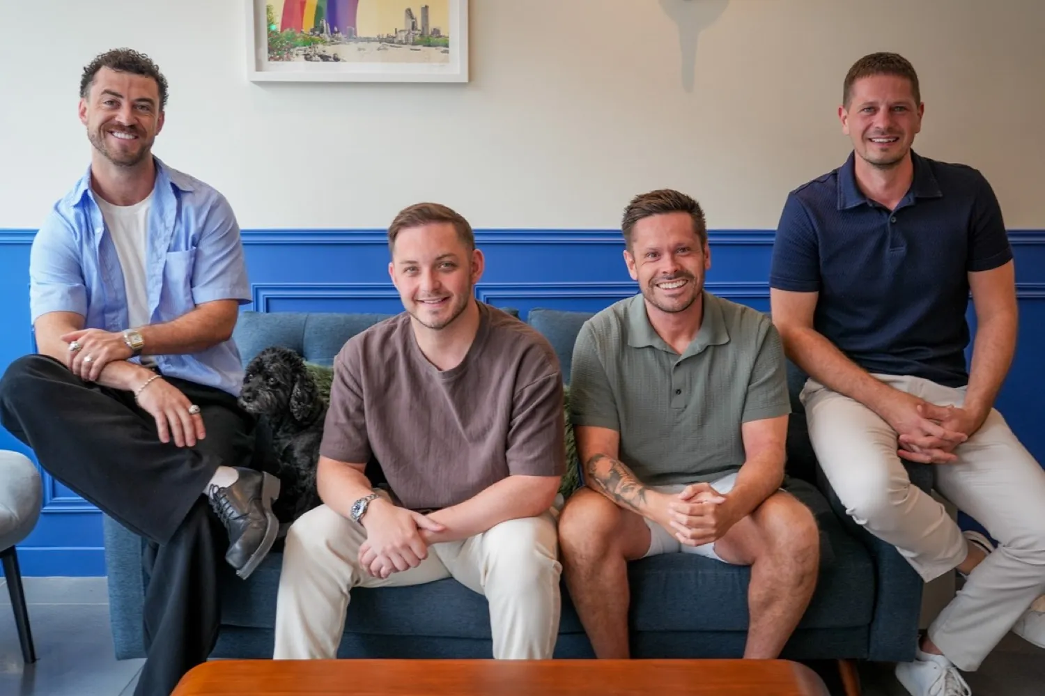 The Paramount Properties sales team seated together with the office dog