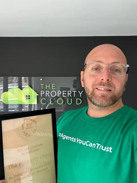 A member of The Property Cloud wearing the network's Agents You Can Trust shirt