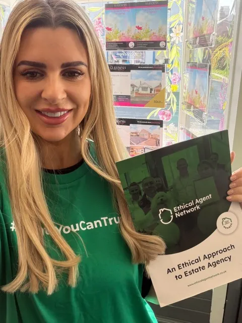 A member of LL Estates wearing the network's Agents You Can Trust shirt